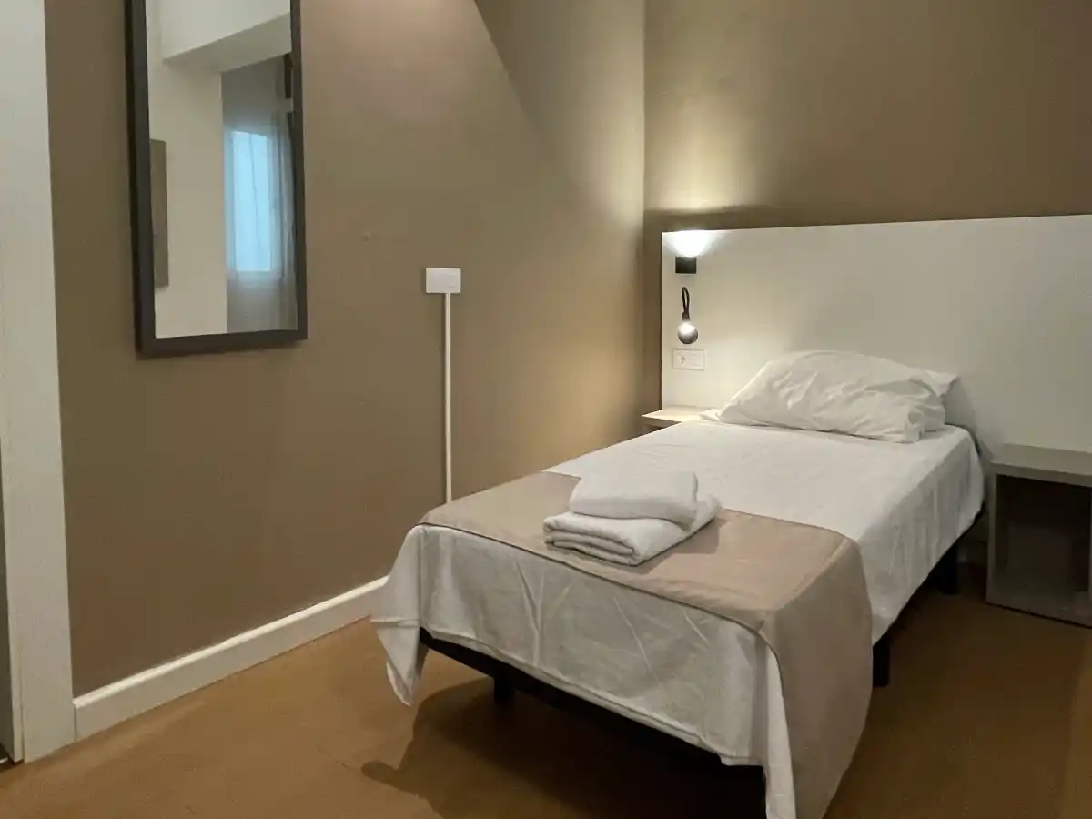 Bed in a single room at PlanetHotels Blue
