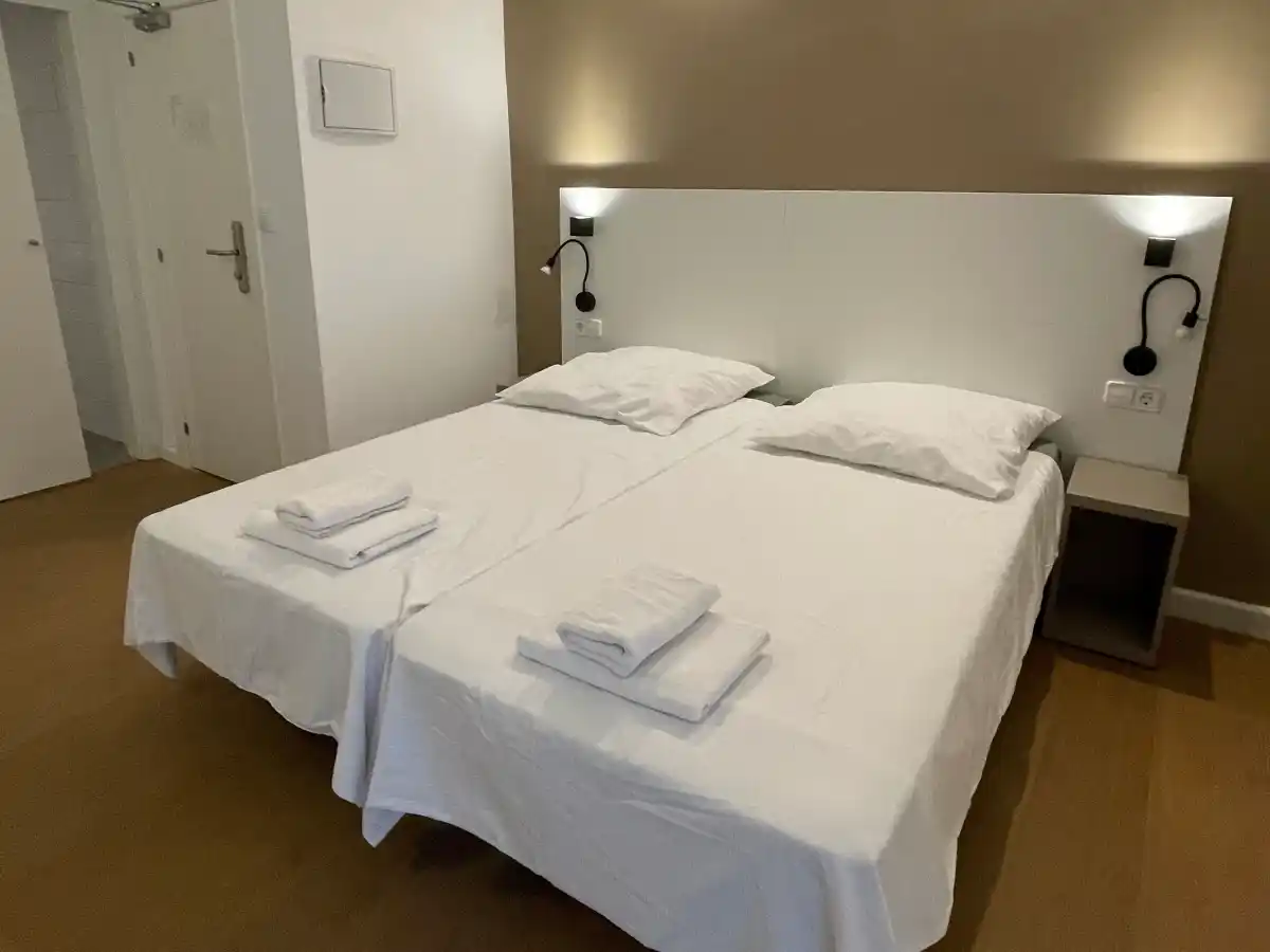 Bed in a double room at PlanetHotels Blue